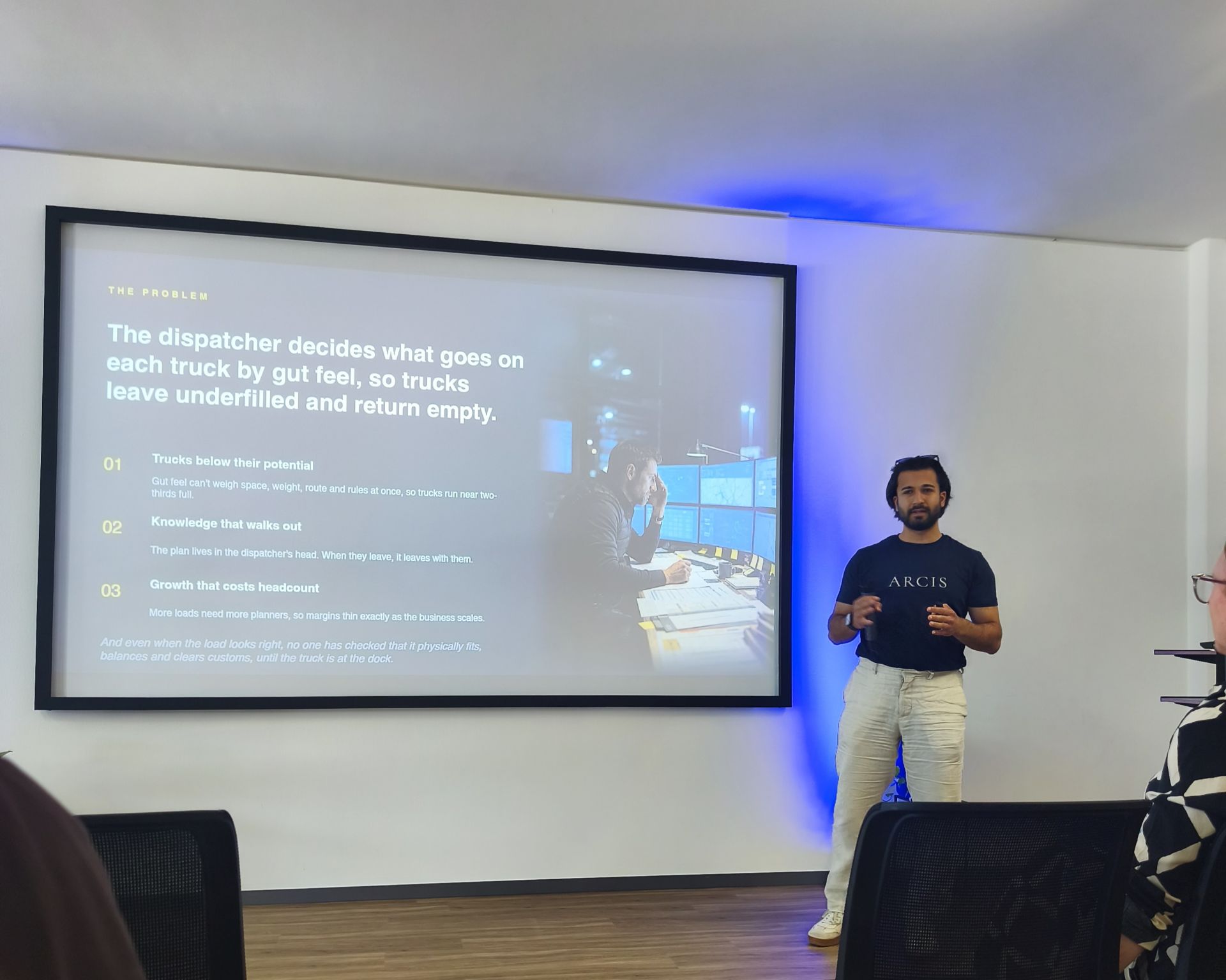Onur Yılmaz presenting the earlier ARCIS logistics work to investors at gate